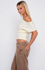 In A Spiral Cinched Waist Off Shoulder Knit Top Cream