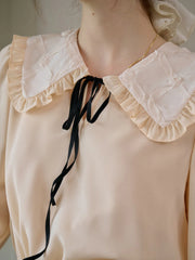 Jolie Doll Collar Contrasting Lace-up Pleated Blouse